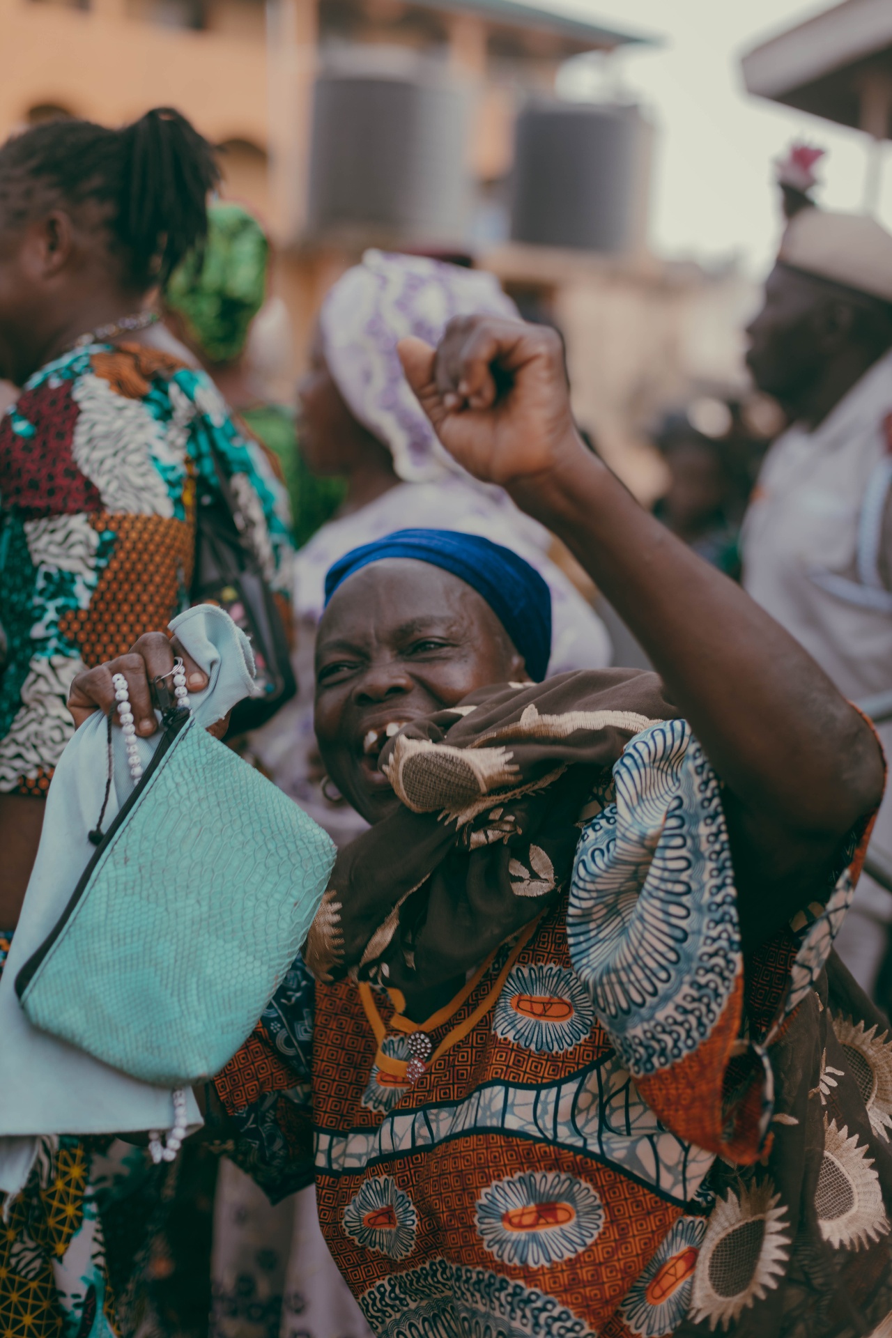 A woman cheering along the procession route