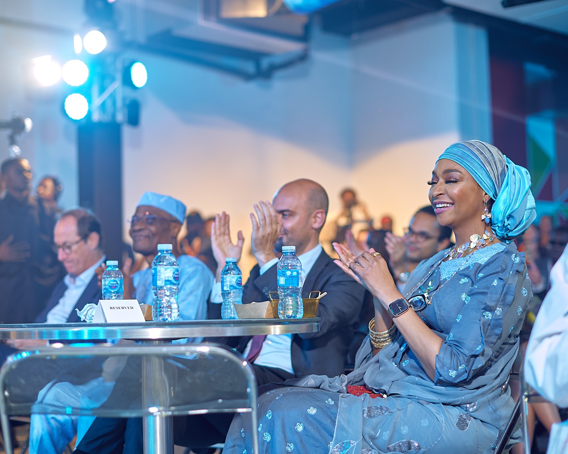 Front-row guests applauding during the Afrobeat Rebellion opening programme