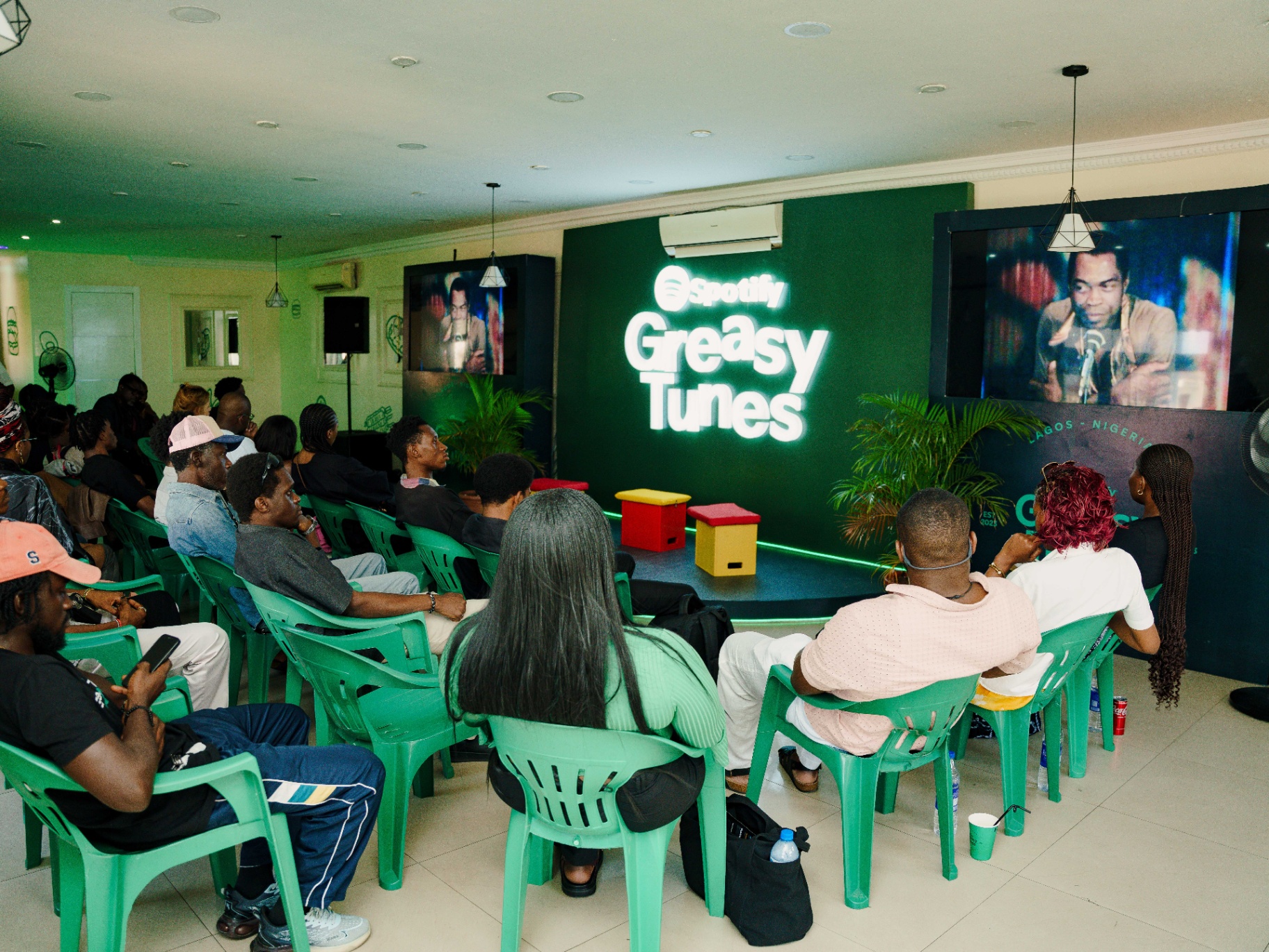 Audience watching an archival Fela Kuti screening at the Afrobeat Rebellion programme