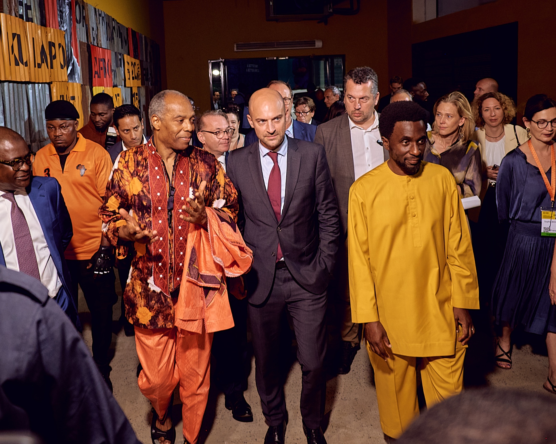 Femi Kuti leading French officials through the Afrobeat Rebellion exhibition in Lagos