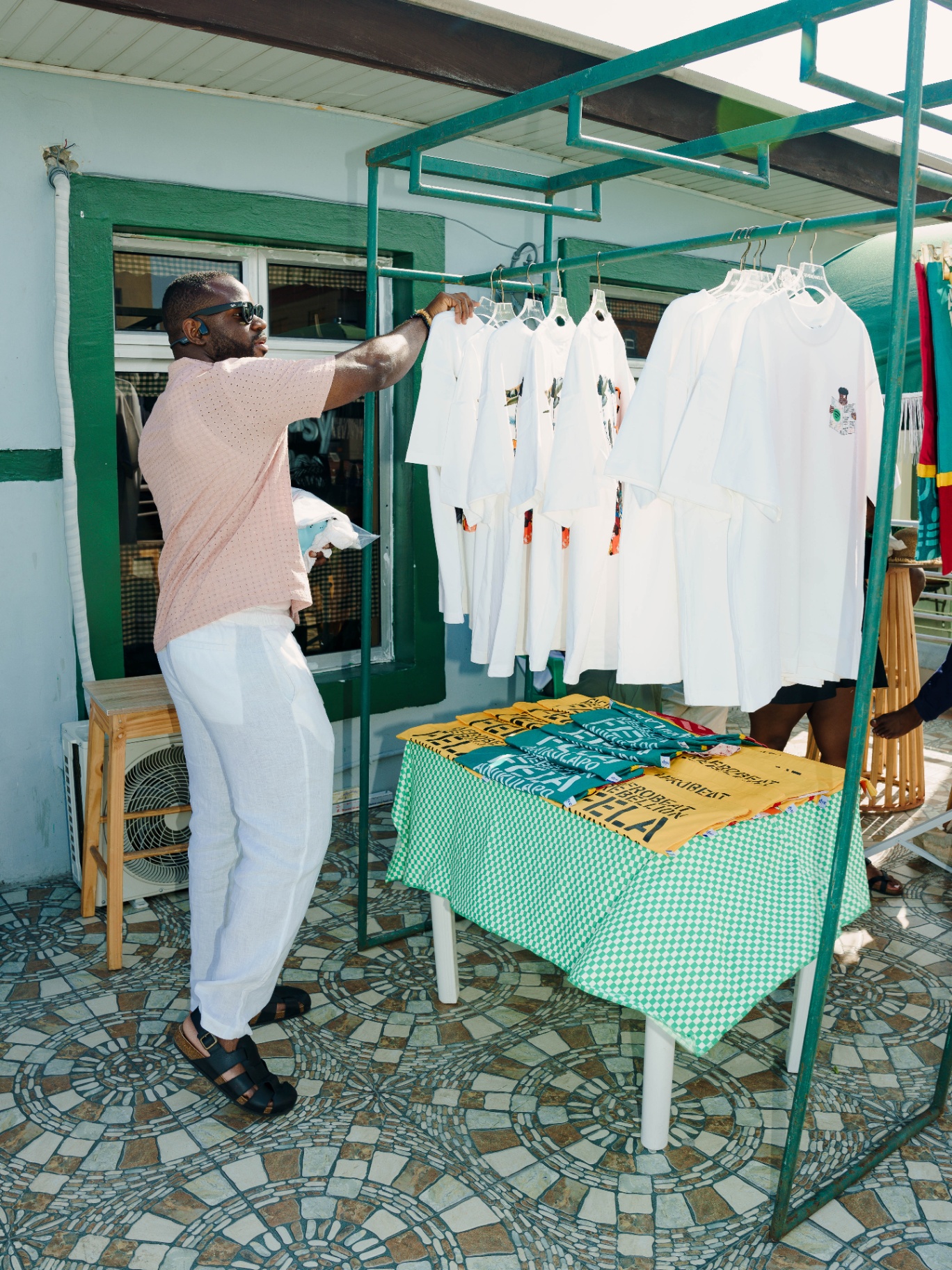 Afrobeat Rebellion exhibition merchandise and tote bags on display