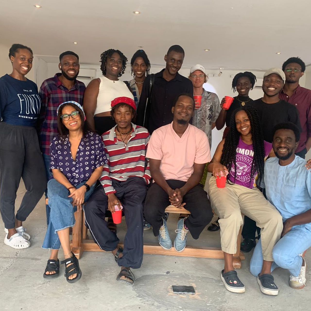 Group portrait of the Manifesto Seeds cohort inside the workshop space in Lagos